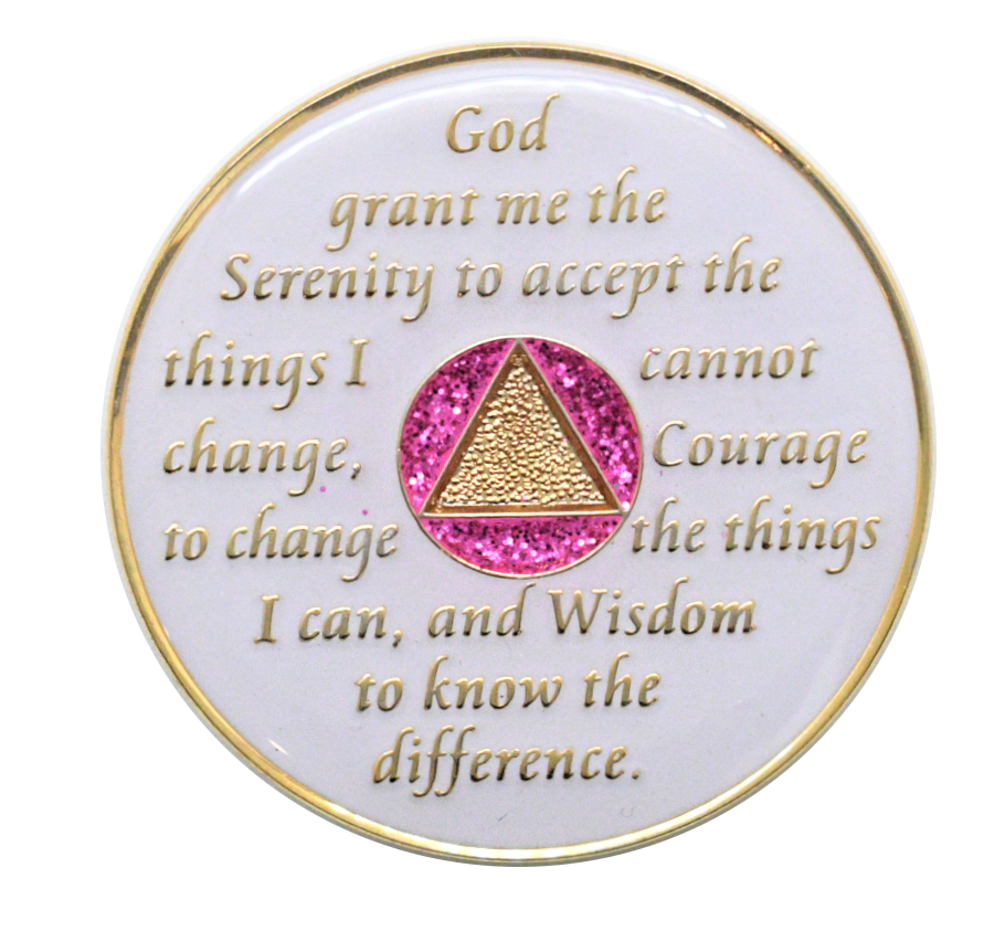 AA recovery medallion glowing in the dark with pink gradient crystal accents