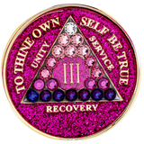 Front of glitter pink AA recovery medallion with pink, purple, and clear crystals