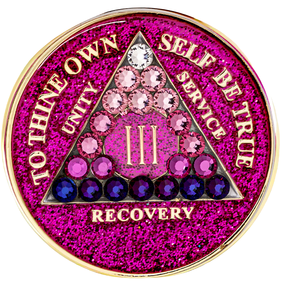 Front of glitter pink AA recovery medallion with pink, purple, and clear crystals
