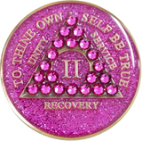Front of glitter pink AA recovery medallion with matching pink crystals