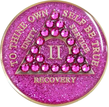 Front of glitter pink AA recovery medallion with matching pink crystals