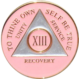 Pink and silver AA recovery medallion for sobriety years 1 through 50