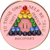 Pink AA recovery medallion with rainbow crystals for sobriety years 1 through 50
