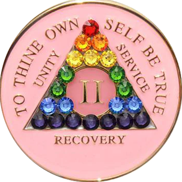 Pink AA recovery medallion with rainbow crystals for sobriety years 1 through 50