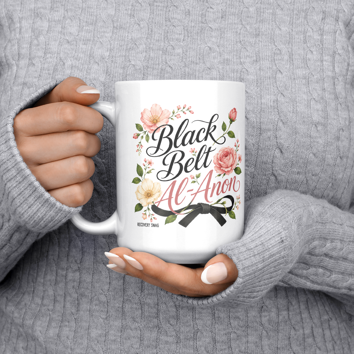 Black_Belt_Al-Anon_Recovery_Coffee_Mug__15ozWhiteMugLifestyleLHChest_Mockup.png_15824892