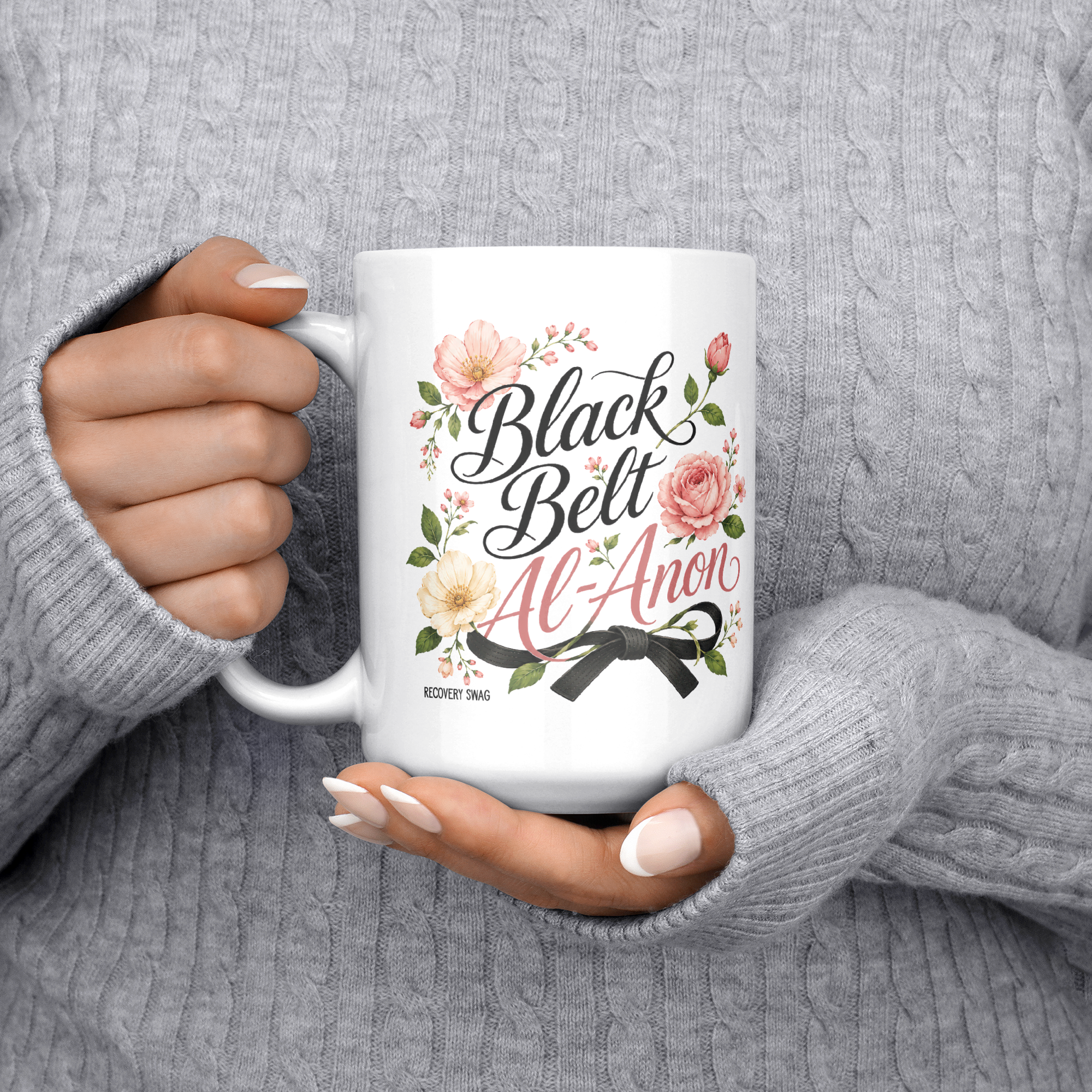 Black_Belt_Al-Anon_Recovery_Coffee_Mug__15ozWhiteMugLifestyleLHChest_Mockup.png_15824892