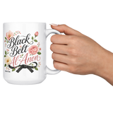 Black_Belt_Al-Anon_Recovery_Coffee_Mug__15ozWhiteMugLifestyleRHCheers_Mockup.png_15824894