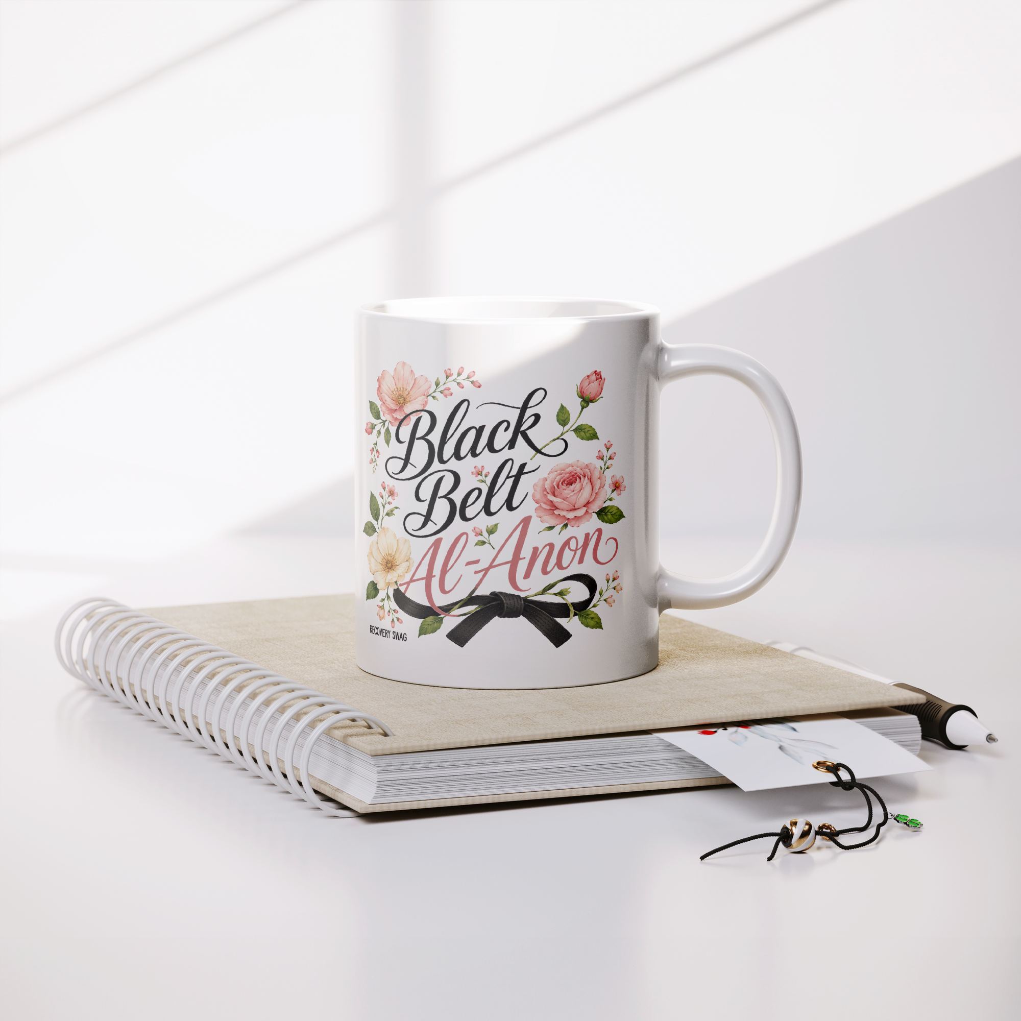 Black_Belt_Al-Anon_Recovery_Coffee_Mug__Lifestyle_Notebook_Mockup.png_15824885