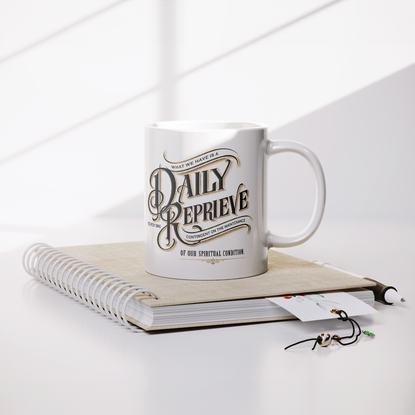 Daily_Reprieve_Recovery_Coffee_Mug__AA__Lifestyle_Notebook_Mockup.png_15824915
