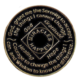 Back of black NA recovery medallion with the Serenity Prayer and Miracles Happen message
