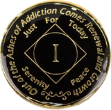 Front of black enamel NA recovery medallion with gold-plated details and Roman numeral milestone year