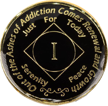 Front of black enamel NA recovery medallion with gold-plated details and Roman numeral milestone year