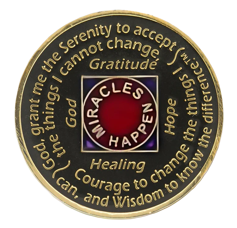 Back of black and red NA recovery medallion with the Serenity Prayer and Miracles Happen message