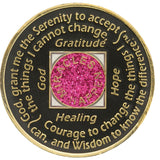 Back of glitter pink NA recovery medallion with white crystals and Serenity Prayer