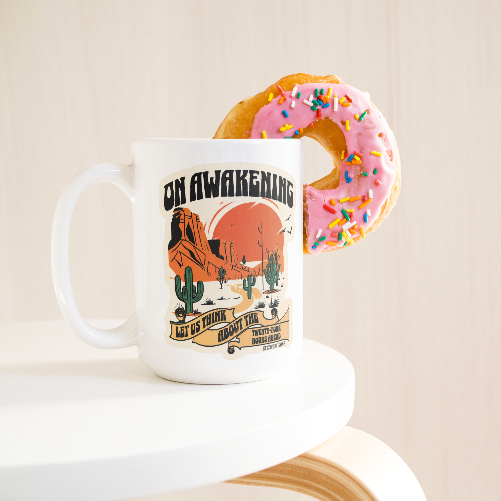 On_Awakening_Recovery_Coffee_Mug__AA_Gi_15ozWhiteMugLifetsyleDonutLH_Mockup.png_15825039